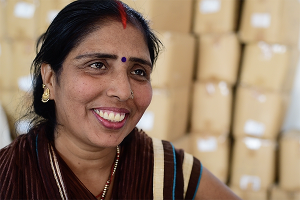 Bebi smiles and looks at the camera, she is leading the fight against period poverty.