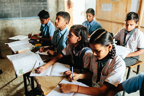 Students sits at desk and study at a school in Nagpur, India.