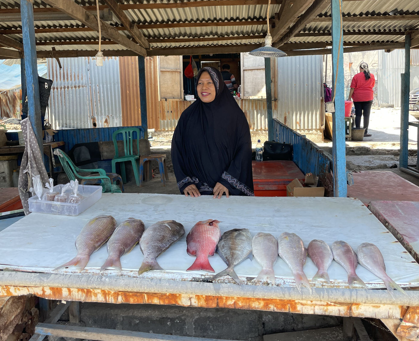 Our standing at her fish market stall