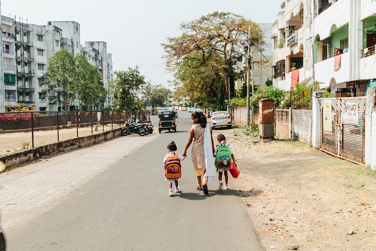 Madhuri walks her children to school